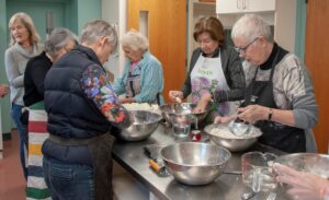 Volunteers preparing pastry 