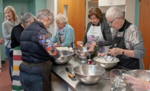 One of the many Christmas Kitchen baking sessions – here pastry is being prepared for our famous tourtieres